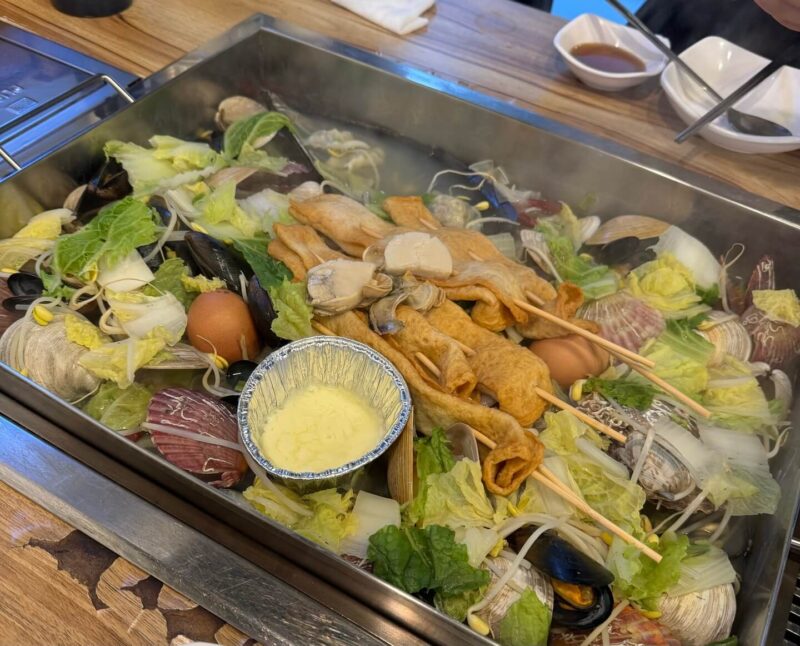 a large metal tray with food on it